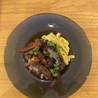 Pasta a la huancaina with lomo saltado  at Lounge del Brujo Centro Histórico in Arequipa