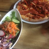 Pepperoni pizza with salad at Duke Bullock's Vegan Cafe in Scarborough