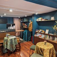 Indoor seating - a combination vegan coffee shop and menswear store with books to read and exchange. at Cuffeine: Plant-based Coffee in Phnom Penh