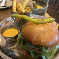mallow house burger: signature fried plant chick+n, amba pickle glaze, roast pepper taktouka, pimento mayo, brioche bun, pickles, lemon pepper fries  at Mallow - Canary Wharf in East London