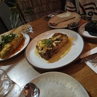 From left to right: mujadara cabbage dolma, porcini ragu lasagna, and shiitake toast at Mallow - Canary Wharf in East London
