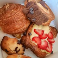 Ham and cheese croissant, supreme roll, strawberry custard, chocolate chip madeleine at TheDorkyFrench Vegan Bakery in Glasgow