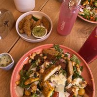 Our dishes: Caesar salad and chicken wings   at Hulala in Dusseldorf