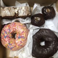 Homer & chocolate donuts, caramel salted brownies, pumpkin bread loaf.  at Sweet Theory Baking Co. in Jacksonville