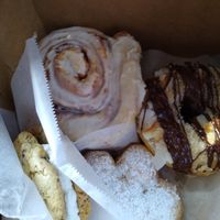 Whoopie pie or cookie sandwich, huge cinnamon roll, samona donut, powdered monkey foot pastry at Sweet Theory Baking Co. in Jacksonville