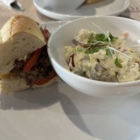 Philly Cheesesteak with a side of potato salad   at Stillfood Bistro & Cappuccino Bar in Penticton