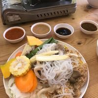 Turned into a great rice, noodles and mushroom veggie plate, with soy sauce and peanut sauce to add as your option at Kinn's The Buta in Udon Thani