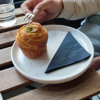 Pistachio cruffin at Crave Coffee & Bakery in Rotterdam