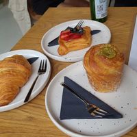 Vegan croissant, strawberry tart and pistache cruffin at Crave Coffee & Bakery in Rotterdam