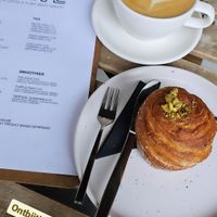 Latte and a pistachio cruffin at Crave Coffee & Bakery in Rotterdam