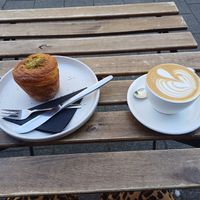 Pistachio cruffin and flat white, Crave Coffee Rotterdam, 20 June 2025 at Crave Coffee & Bakery in Rotterdam