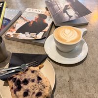 Oat milk cappuccino and vegan blueberry cake  at Coffee Habits  in Haarlem