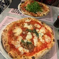The vegan on is the one with lots of rocket but they were both huge! at Pizza Beppe in Amsterdam