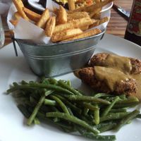 Country fried tofu, Cajun fries, and green beans. at Southern Charm Kitchen in Gainesville