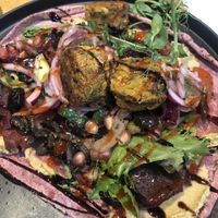 Vegan beetroot flatbread with hummus falafels and Greek salad   at Y Sied Goffi in Carmarthen