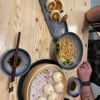 Water fried bao, noodles, and steamed bao partially eaten  at Chopstickers in Denver