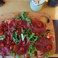 Pinsa with veg cold cuts and soft veg cheese (stracchino) at Amato in Mornago