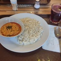 White rice and egusi soup, with hibiscus tea at Tribes by Nelz Pan in Bucharest