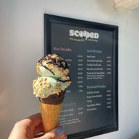 fully vegan mint choc chip in a chocolate dipped waffle cone with nuts and chocolate sauce at Scooped in Scarborough