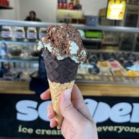 Chocolate waffle cone with mint choc chip ice cream and chocolate sprinkles!   at Scooped in Scarborough