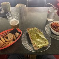 Vegan feta and avocado on bread and a lentil dish.   at La Sinsorga - Cultural Space in Bilbao