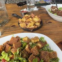 Schnitzel salad and crispy fries  at Lori Restaurant & Deli in Dominical