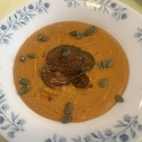 Cream of lentil soup topped with kimchi pickles   at Kultura Diktuet in Astana