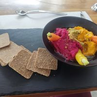 Carrot and beetroot hummus with crackers at Artesano 81 by Crepes & Waffles in Cundinamarca