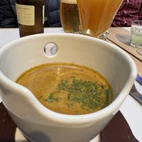 Lentil soup with tangerine & panela drink  at Artesano 81 by Crepes & Waffles in Cundinamarca
