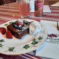 Walnut cake and a refreshing berry drink at Peacocks Tearoom in Ely