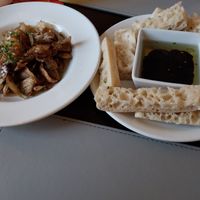 Crispy potato skins and fresh bread with balsamic and olive oil at The Royal Oak in York