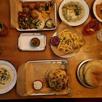 hummus, falafel, crispy fries, cauliflower, pita at Café NIL in Vienna