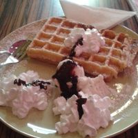 Waffle with bounty ice cream,  whipped cream and chocolate topping - all vegan!  at Kiez & Kugel in Berlin