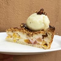 Peach&Nectarin Custard pie: crispy cake with vegan custard, pistachio ice-cream and caramelized pistachios at Nagotove - Наготове in Moscow