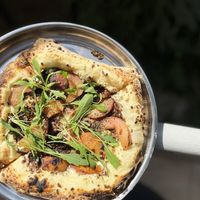 Peach Preach Pizza with cashew sauce, grilled peaches, homemade fatty soy mince, Armenian capers, arugula at Nagotove - Наготове in Moscow