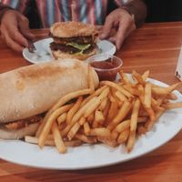 po boy with thyme fries and the big wac burger! at Green New American Vegetarian in Tempe