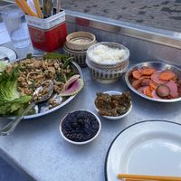 Laab tofu, jeow bong (darker color), jeow eggplant (lighter color), sticky rice, and pickles—this was a good amount of food for 2. We took some of the jeow bong and pickles home. at Gai Noi in Minneapolis