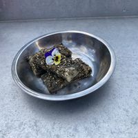 The black sesame mochi dessert. Small (esp for $9) but really tasty. Hot/crispy with soft/chewy interior (similar to sesame balls).  at Gai Noi in Minneapolis