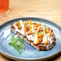 toast with aubergine babaganoush, grilled carrots, tahini and roasted chickpeas  at botànic in Barcelona