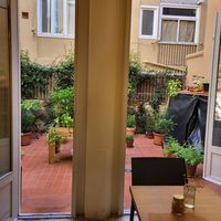 View out from the restaurant to the courtyard full of herbs at botànic in Barcelona