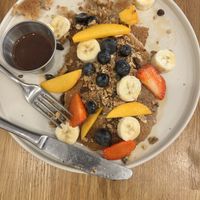 Pancakes with granola. Fruit and chocolate ganache   at botànic in Barcelona
