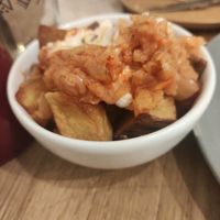 Patatas bravas con kimchi at botànic in Barcelona