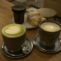 Matcha latte, chocolate croissant and tea  at botànic in Barcelona