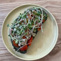 Pesto toast with tofu feta cheese, baby tomato and sprout at IVEGAN SUPERSHOP BEN THANH - Healthy Plant Based Cafe in Ho Chi Minh City