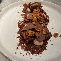 "KINDER MALO": HAZELNUT CREAM, CHOCOLATE CAKE, EVOO SORBET WITH CUZCO CHOCOLAT, BEET AND COCOA CRUMBLE. at La Huerta Funky Castizo in Madrid