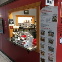 Ordering counter. Great menu board with full descriptions of each item. Vegan & veganizable items are clearly marked. at Superior Waffles in Superior