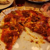 (I got too excited and started before taking a pic) create your own 12" . Mine had vegan cheese, red sauce, jalapeños, sweetcorn, red pepper, red onion, sundried tomatoes, nduja a at Pizza Punks in Liverpool