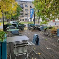 Seating outdoors at Yatta Vegan in Warsaw