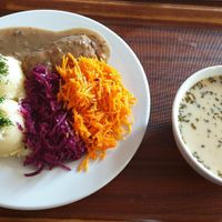 Vegan zrazy with mashed potatoes and salad, and a bowl of żurek (sourdough soup) at Vega in Wroclaw