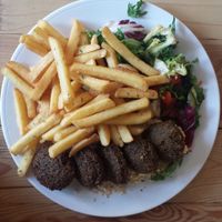 Falafels with hummus, fries and salad at Vega in Wroclaw